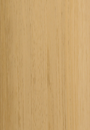 Close-up of a wooden surface with a light brown color and visible grain pattern.
