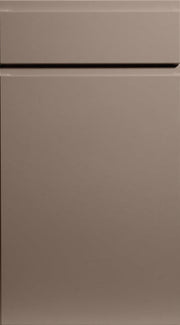 A supermatt cashmere colored kitchen cabinet door with a J-Pull handle design.