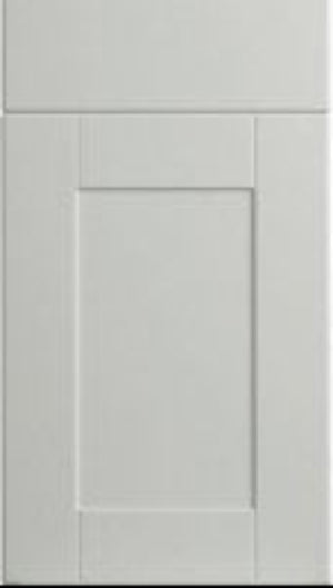 A satin white classic shaker style cabinet door with a simple design featuring a central panel flanked by two side panels, all set within a thin frame.