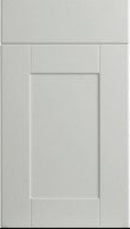 A satin white classic shaker style cabinet door with a simple design featuring a central panel flanked by two side panels, all set within a thin frame.
